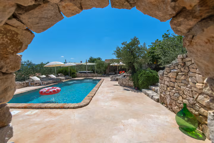 Pool through stone arch